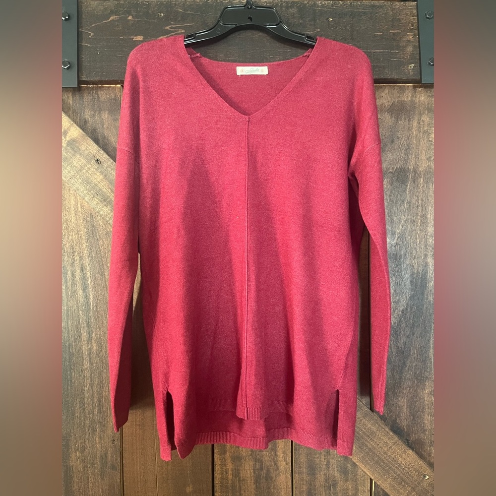 Red sweater, unsure on size, M or L